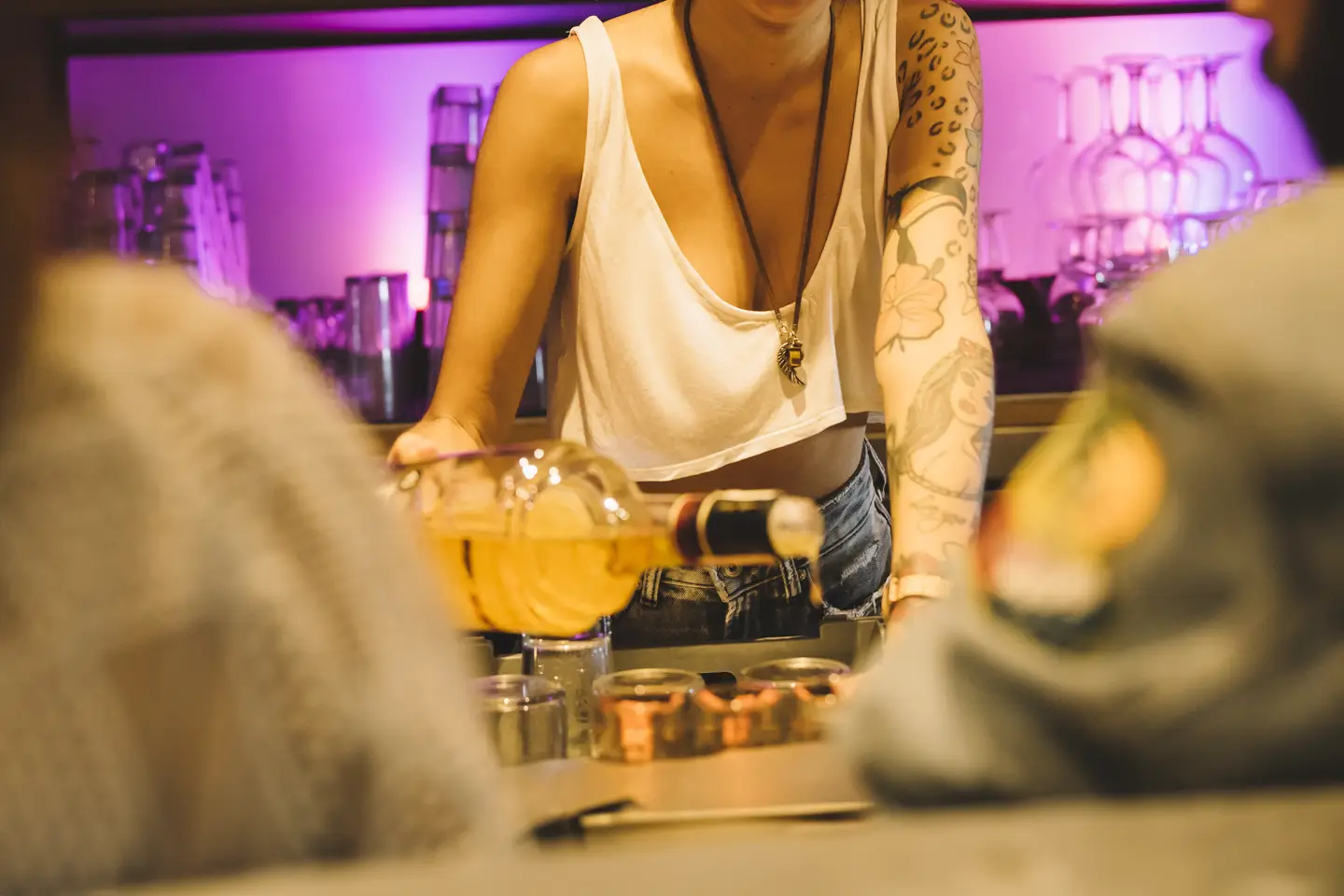 barman mixing cocktail in a bar